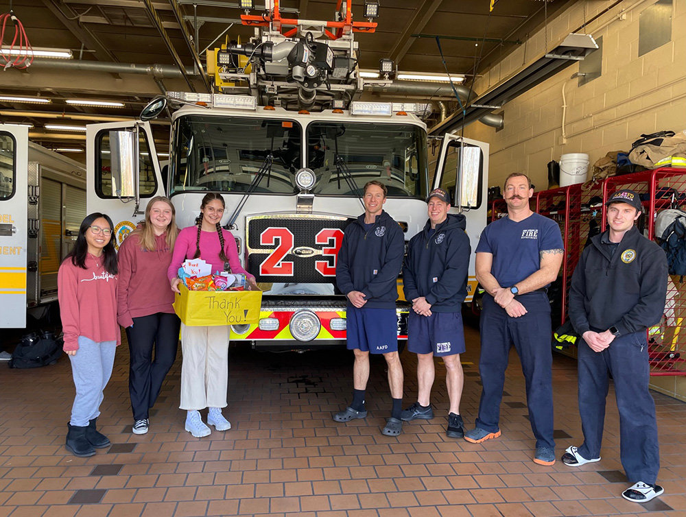 Addie Faust, Jessica Bui and Lily McCallister presented a “hero basket” to special operations firefighters Brett Costantino, Tony DiMauro, Sean Moore and Derek Brindle of Fire Company 23 — Jones Station.