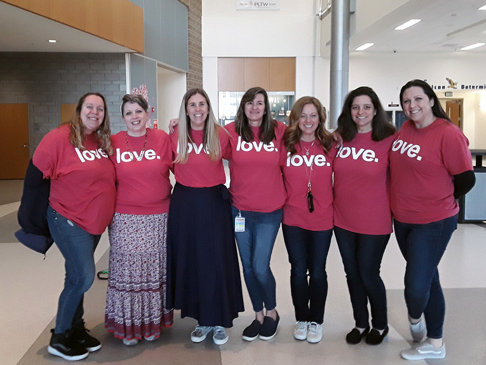 Several teachers gathered after the assemblies at Severna Park High School to show their support for David Flood’s message of kindness.