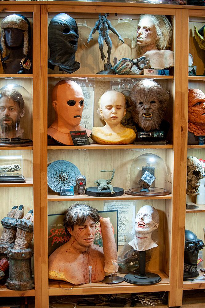 Masks and busts line the shelves of Chris Hearty’s basement.