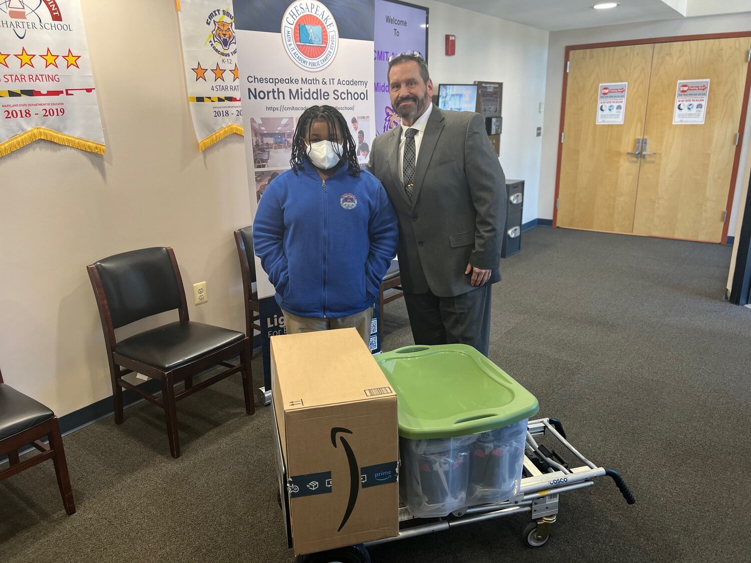 Troy Brooks, a student, stood with James Screven, assistant principal at Chesapeake Math and IT Academy Middle School. Troy has raised more than $1,100 in medical supplies for Screven’s upcoming Ukraine mission trip.