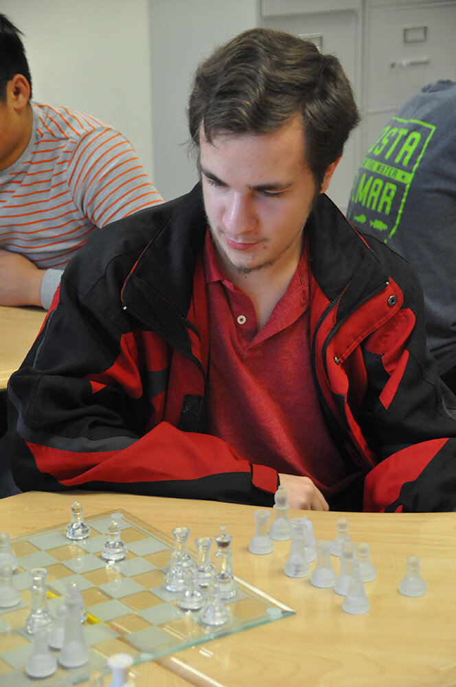 Severna Park High School junior Joshua Felder contemplated his next move during a recent high school Chess Club meeting.