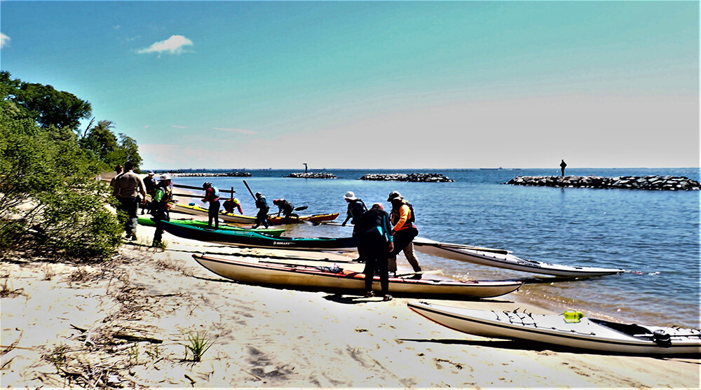 Chesapeake Paddlers Association kayakers landed on the beach for the Beverly Triton Nature Park ribbon cutting in May.