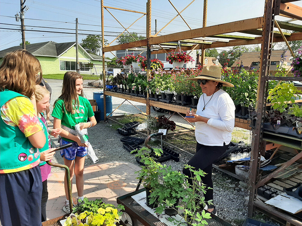 Landscape architect and Anne Arundel Community College professor Anne Gleeson taught the Girl Scouts about invasive species.