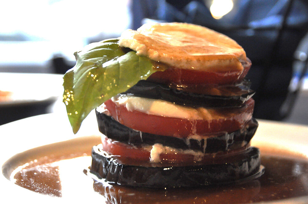 Luna Blu’s offers a tower of sliced tomatoes, grilled eggplant and mozzarella drizzled with balsamic vinaigrette.