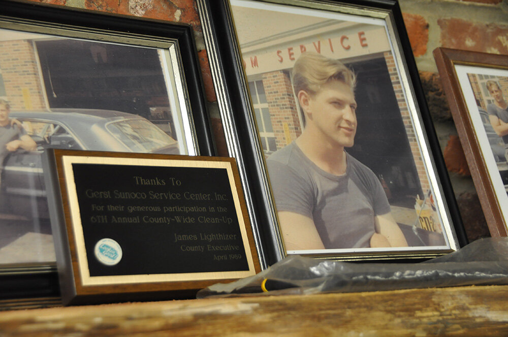 Photos of a young Wayne Gerst adorn the walls of one garage. A photo of Gerst from his Sunoco days sits beside one of the many accolades on display.