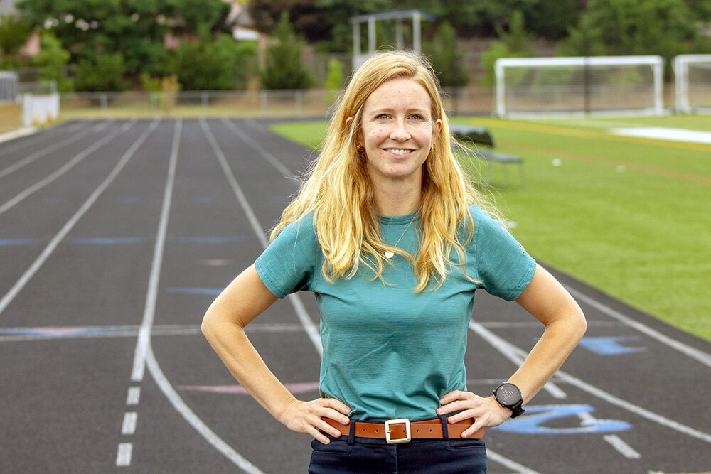 A mother of two, Elizabeth Nabors is enjoying her second summer as Green Hornets track and field commissioner.