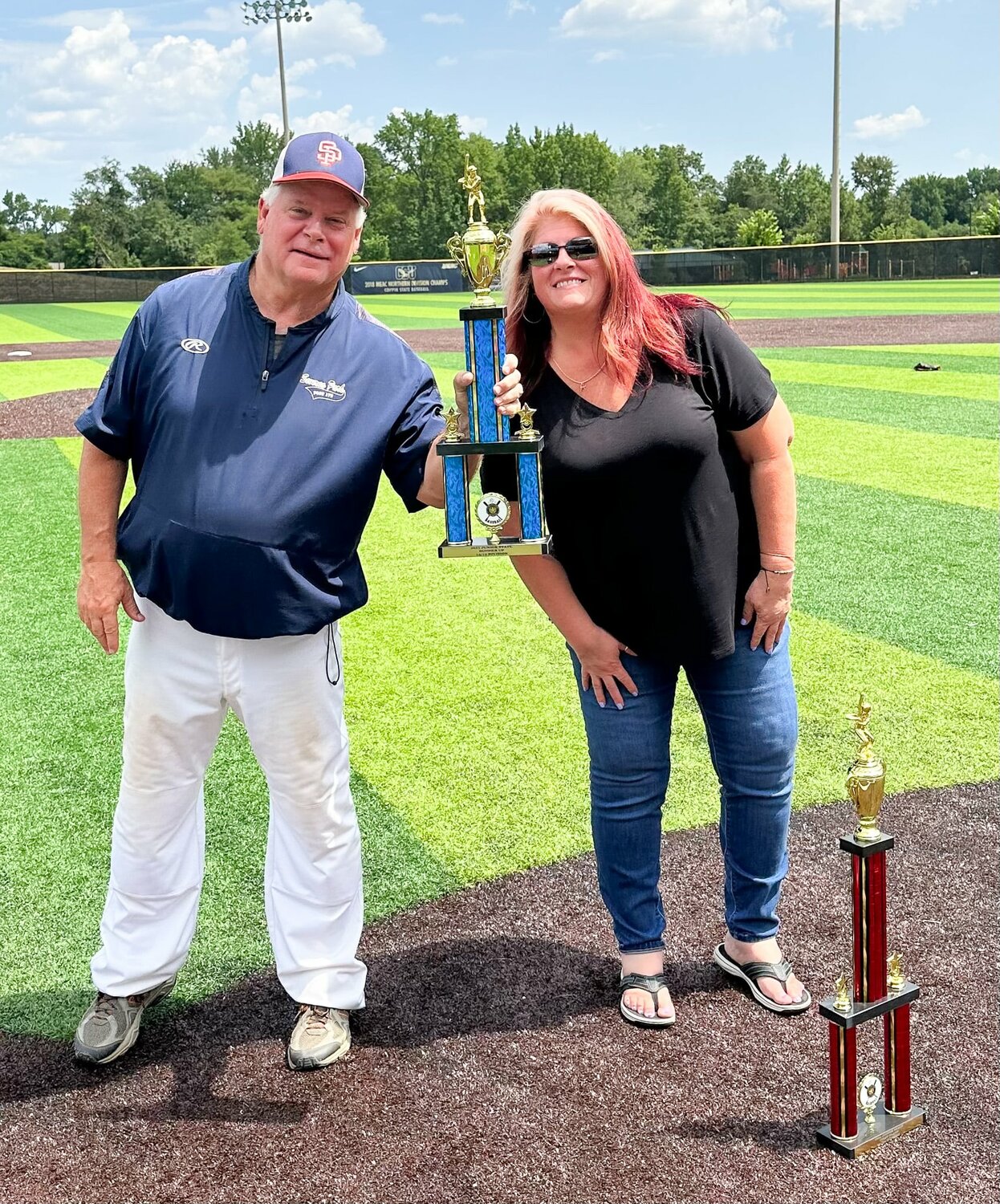 Coach Dave Ferris (left) accepted the runner-up trophy from an American Legion state representative.