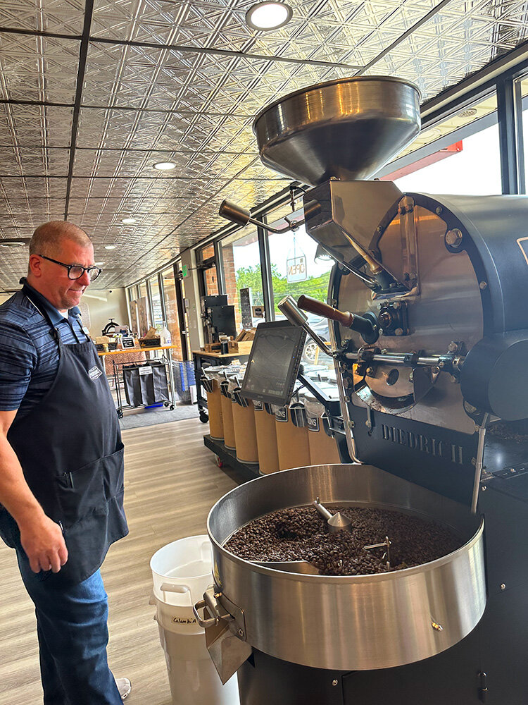 Philip Peters roasted fresh coffee beans on a July Saturday morning at BD Provisions in Severna Park.