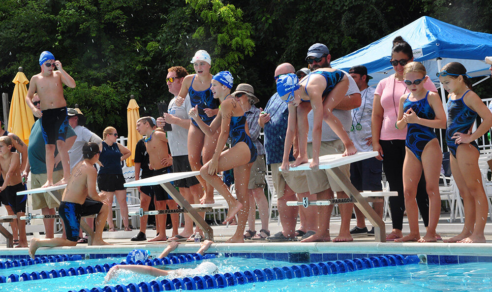Swimmers prepared and cheered for fellow Tidal Waves during the meet’s final relay races.