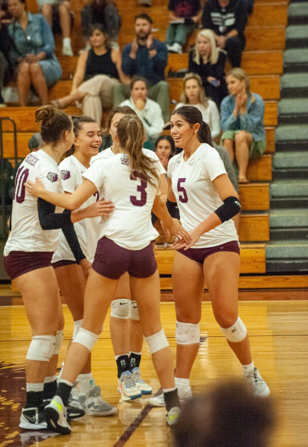 The Broadneck volleyball team celebrated winning a point.