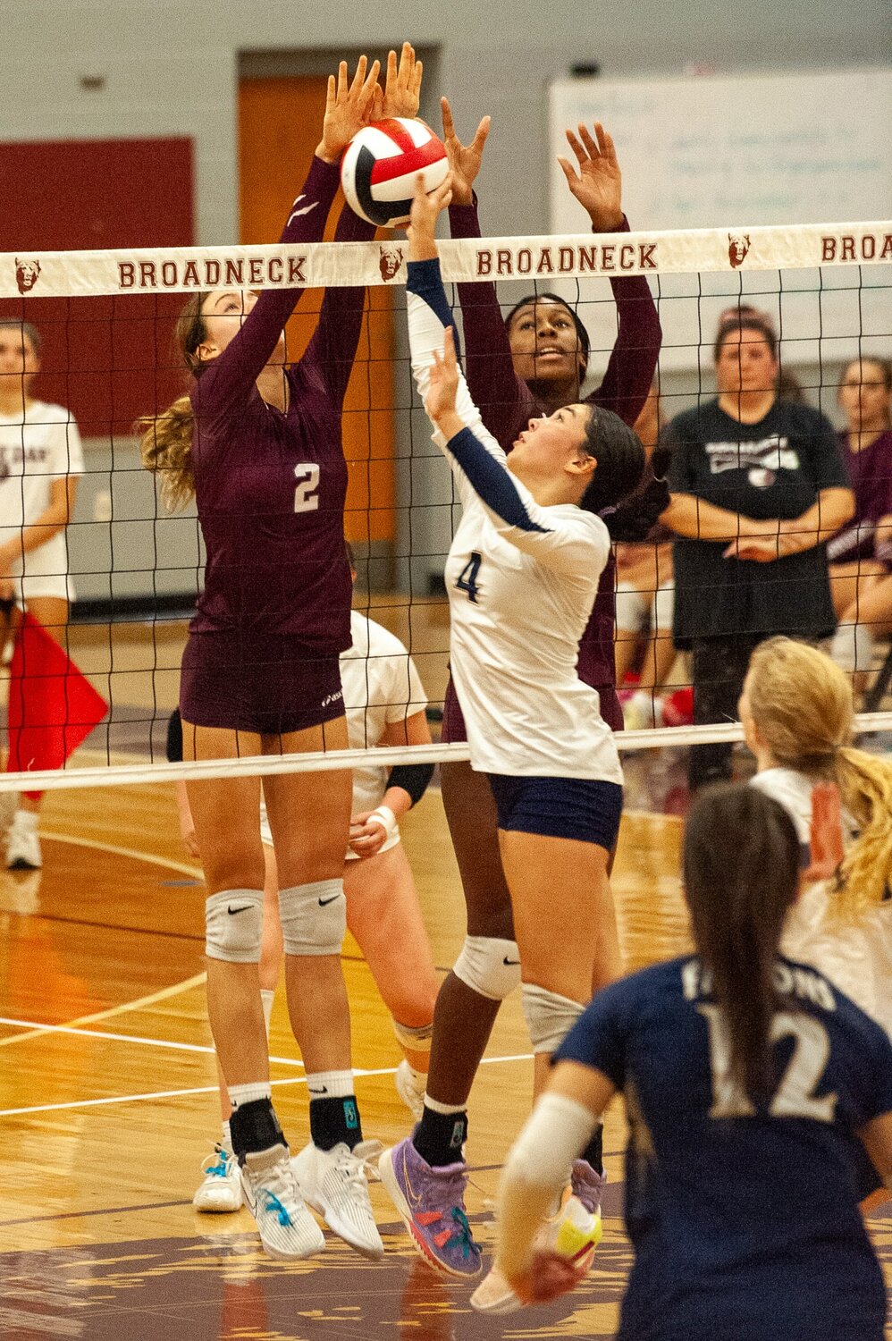 Severna Park’s Jennifer Hong (4) jousted for the ball with Broadneck’s Addison Sladke (2) and Kennedy Smith during the teams’ matchup Thursday at Broadneck High School.