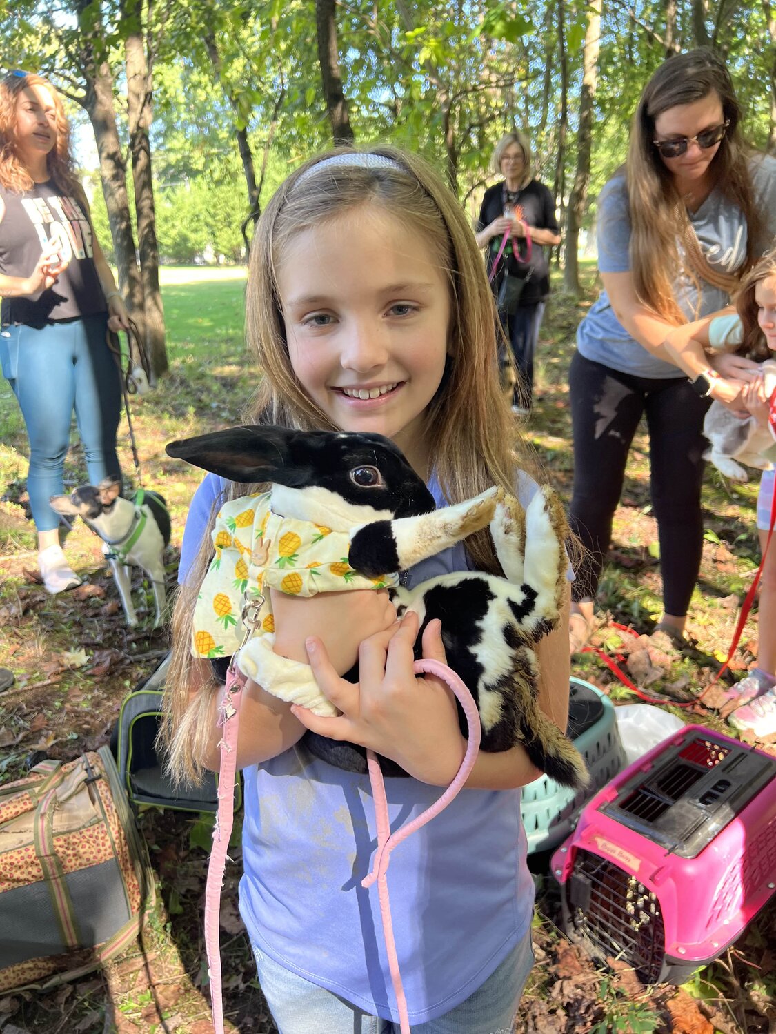 These sisters made sure their family hopped to the annual Blessing of Animals with their long-eared pets.