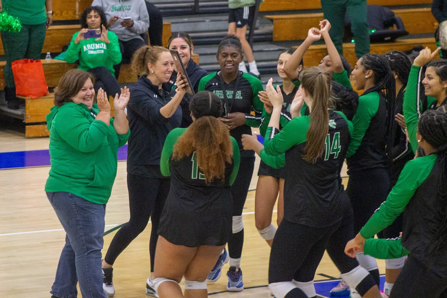 The Wildcats celebrated after winning the volleyball county championship.