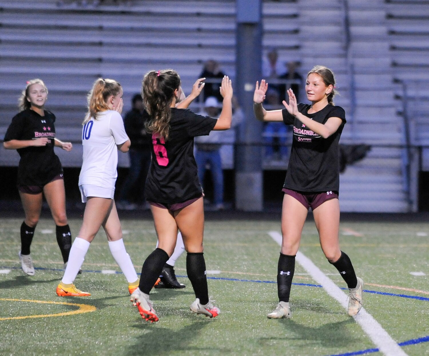 Grace Gartrell (6) and Mia Orso celebrated Orso’s free kick goal that opened the scoring.