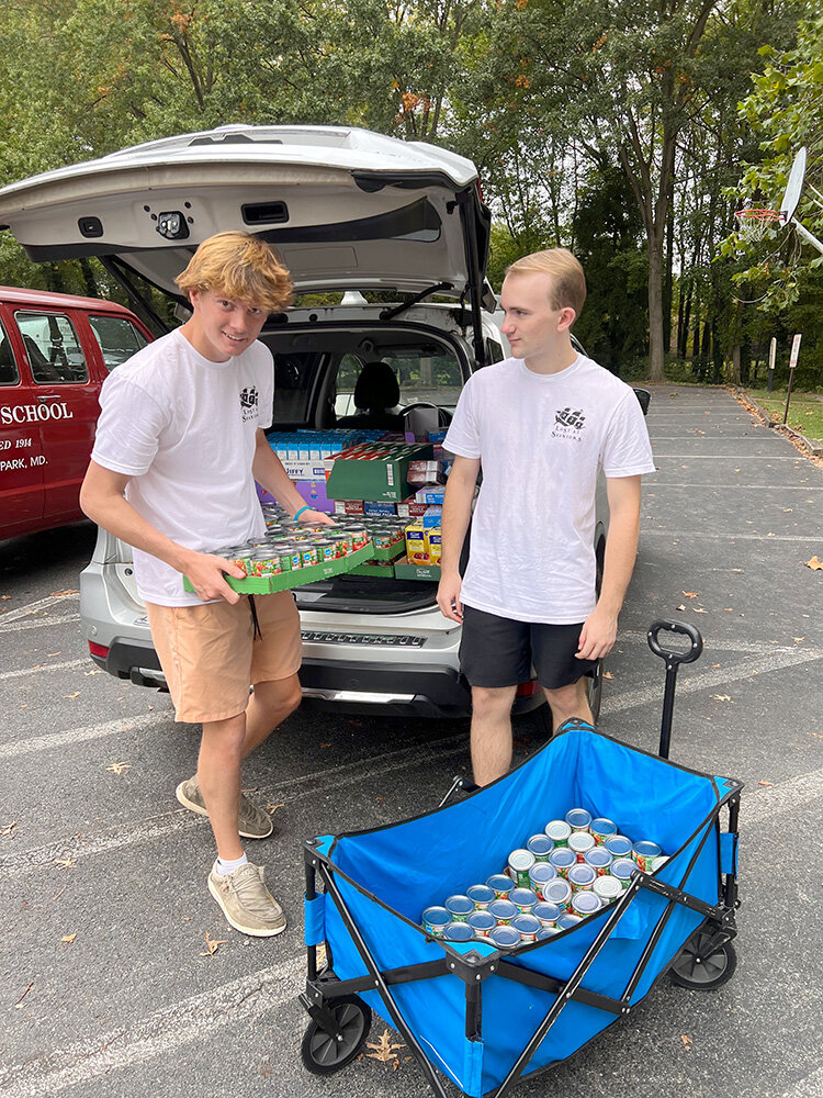 Severn School students Will Friedell (left) and Ben Veiel unloaded cars at SPAN.