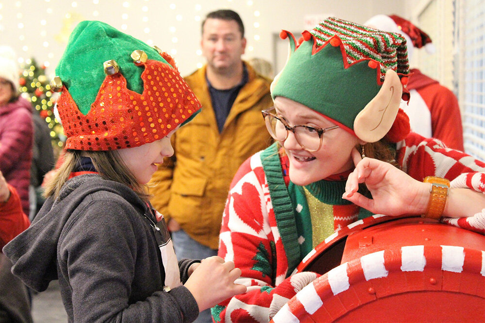 An elf at Frostburg’s Storybook Holiday lent an ear.