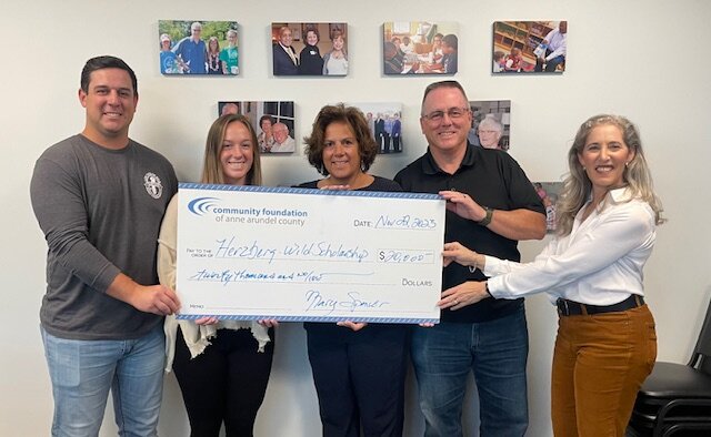 Griffin Wild, Libby Wild, Betz Wild, Bill Wild presented the $20,000 donation to Rosalind Calvin of the Community Foundation of Anne Arundel County.