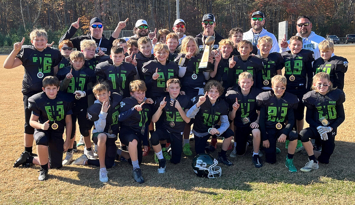 The Green Hornets prevailed in a 26-25 overtime victory over the Dunkirk Warriors to win the Anne Arundel County Youth Football Association B championship in November.
