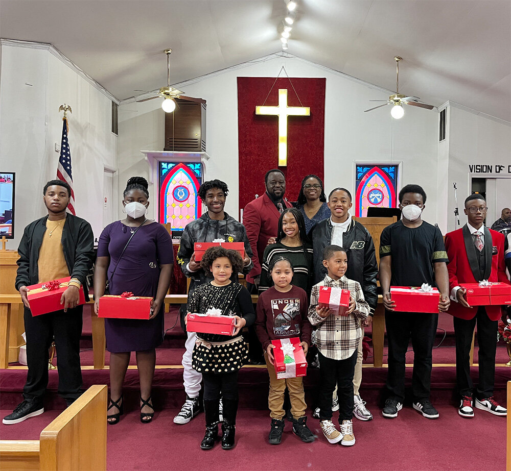 Quincy Wilson coordinated a New Balance shoe giveaway for youth at Wayman Good Hope AME Church this Christmas Eve.