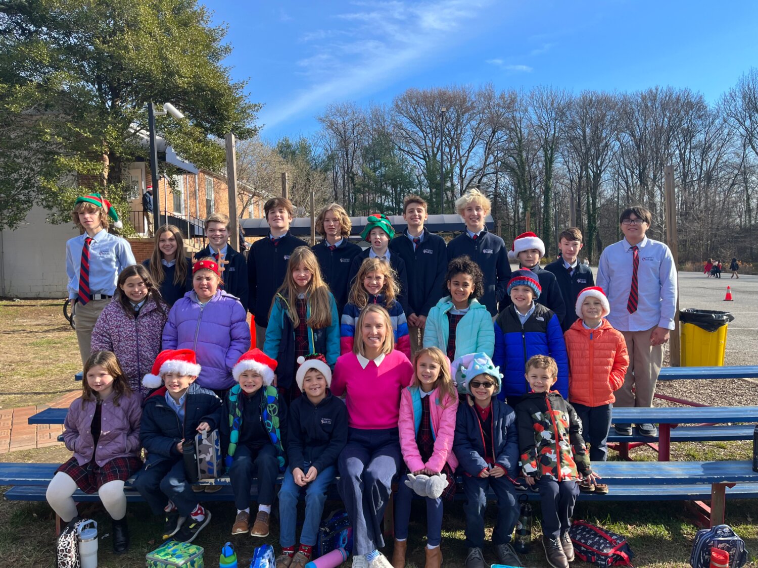 St. Martin’s-in-the-field Episcopal School learning support coordinator Kelcey Wohlgemuth (bottom row, center) posed with her students, ages 6 to 13.