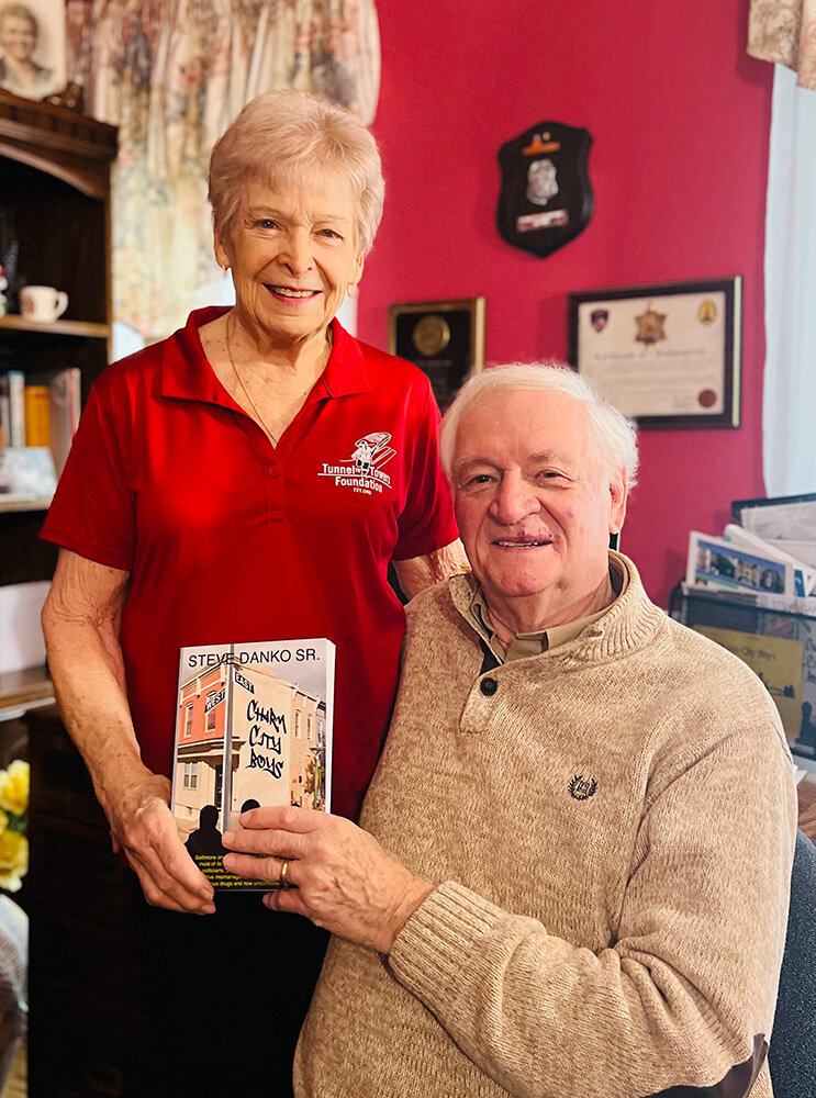 Steve Danko, pictured in his Severna Park home with his wife, Lorry, has given readers a look into crime from the perspective of a former law enforcement officer.