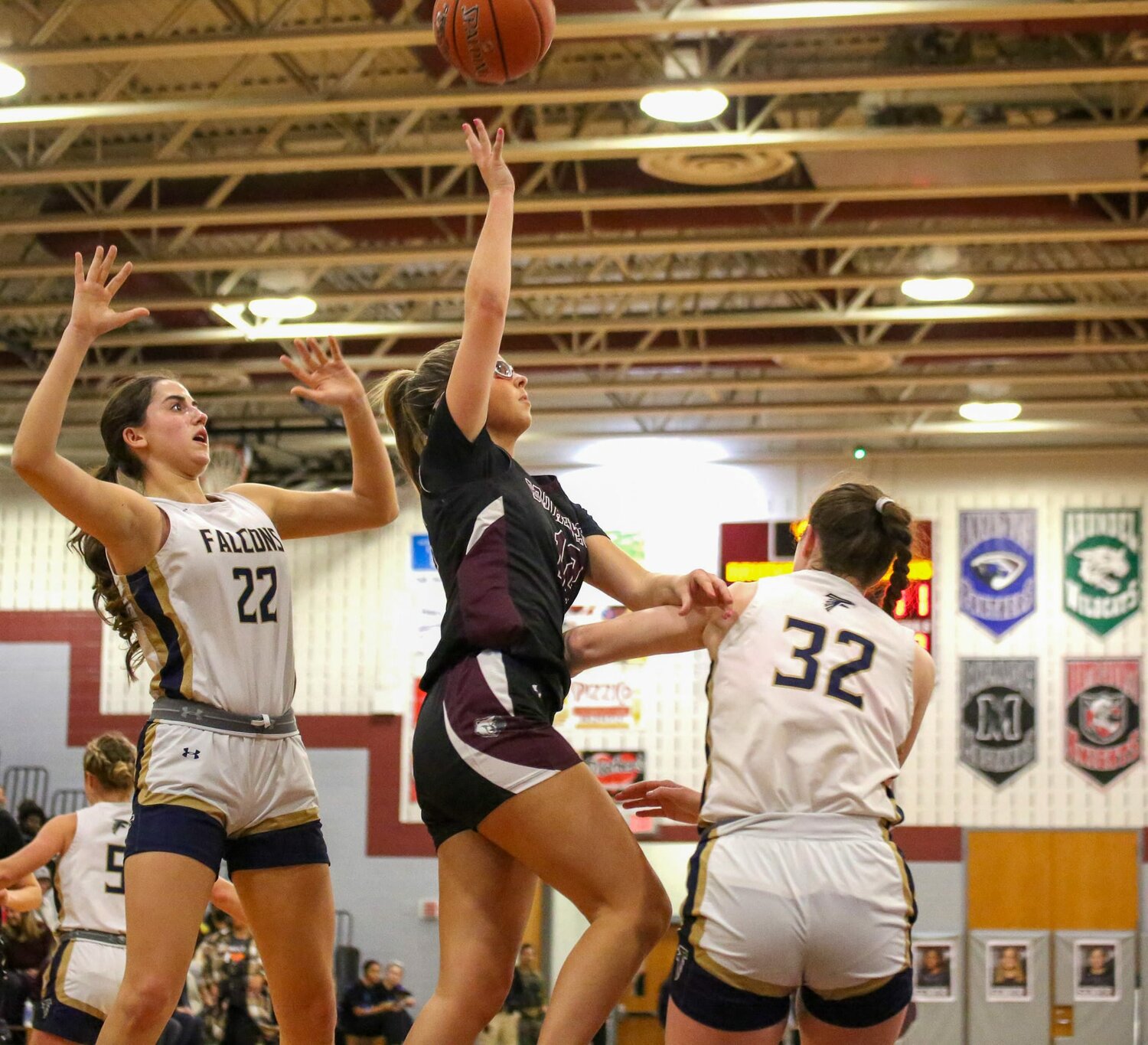 Broadneck’s Mackenzie Wharton (12) attempted a shot over Severna Park’s Charley Coward (22) and Ryn Feemster (32).