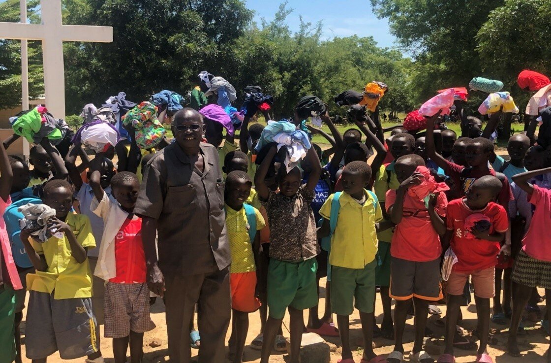 Pastor Stephen Mathiang has received and distributed goods from OGT among school children (pictured), orphans, people living in a leper colony, hospital patients, prisoners, and many others in need in South Sudan.