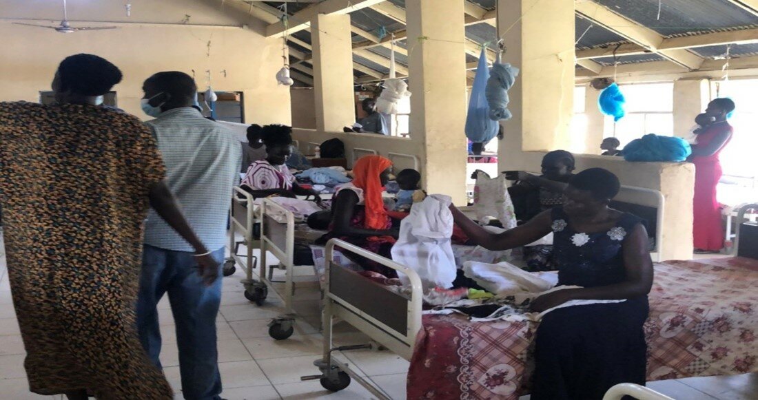 Goods from an OGT shipment to South Sudan were distributed among patients and their families in the children’s ward of a local hospital.