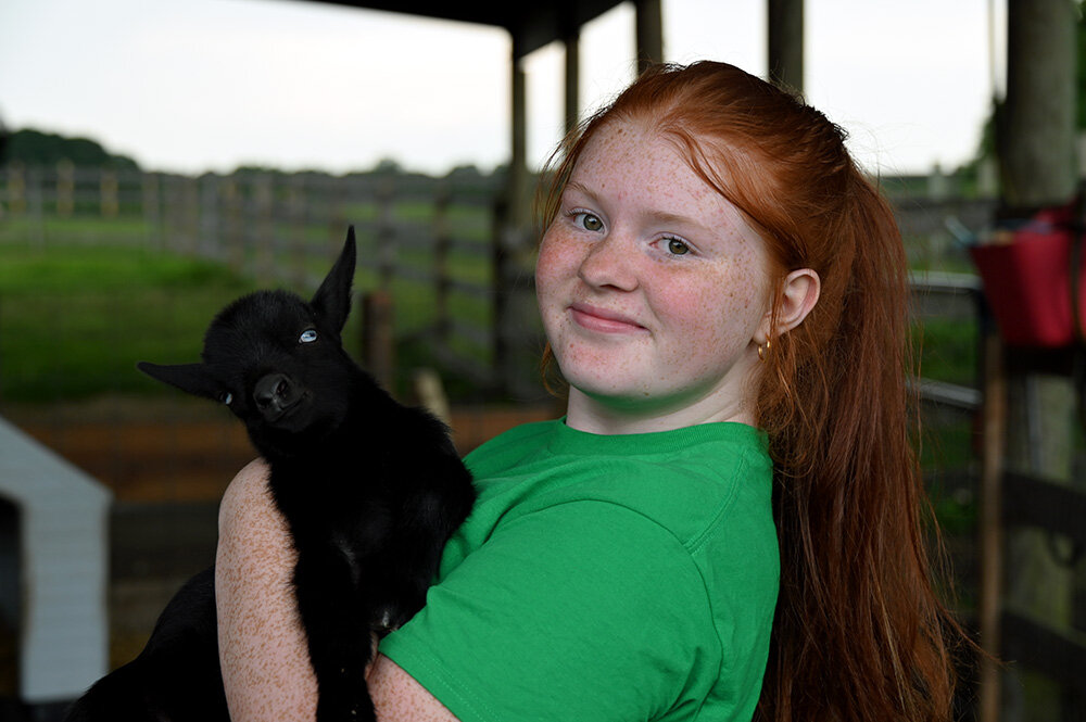 Members of the Kinder Farm Park 4H Livestock Club, including Lily Lawrence, were on hand at Meet the Kids to introduce the newborn animals to visitors.