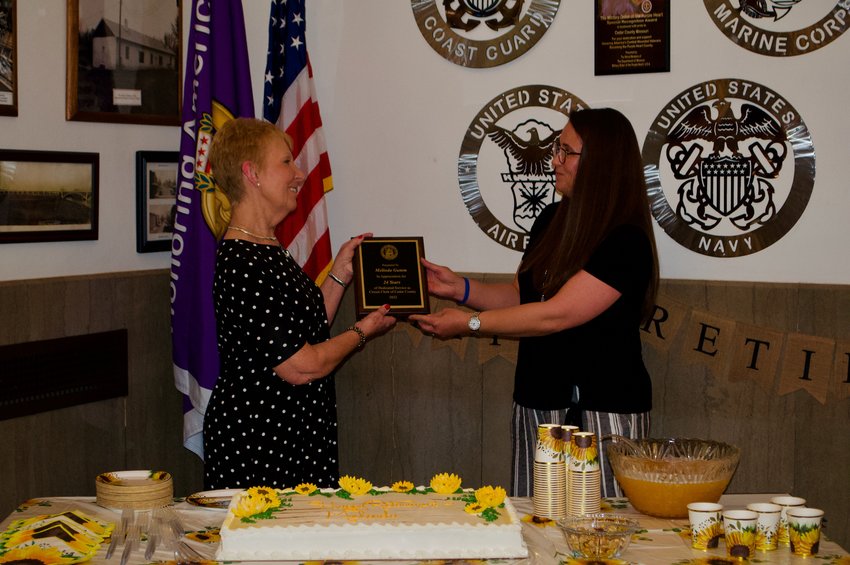 From left, Melina Gumm, who retired last week after serving as Cedar County Circuit Clerk since Jan. 1, 1999, receives recognition from Sarah Turner, Deputy Probate Clerk, at Gumm&rsquo;s retirement party.
