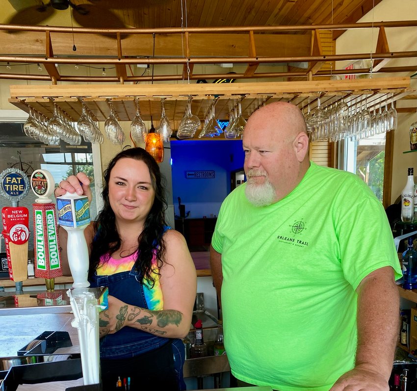 Above, Orleans Trail owner, Chuck Martin, right, and assistant manager, Taylor Park, make plans for the SACC/Orleans Trail Labor Day music festival.
