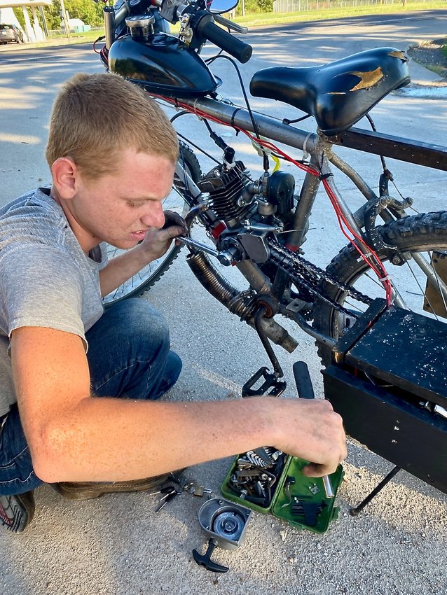 Cody Barton, 16, of Stockton finds a way to travel around town and make his way down fishing paths. Barton has built a motorized kit bike. Barton admits it breaks down occasionally, but he carries tools to work on it. His bike, and the noise it makes, has been a topic of conversation at a couple of city council meetings with the aldermen agreeing that an innovative young person like Cody should be encouraged to continue to build and create. (See Mayor Brandon Cahill&rsquo;s related statement.)