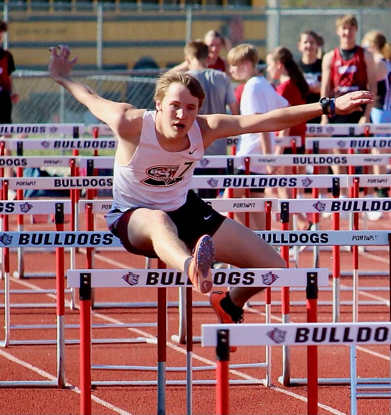 Max Brown competes in the 110 meter hurdles at the El Dorado Springs Bulldog Relays last Tuesday. The Tigers finished 3rd out of 16 teams.