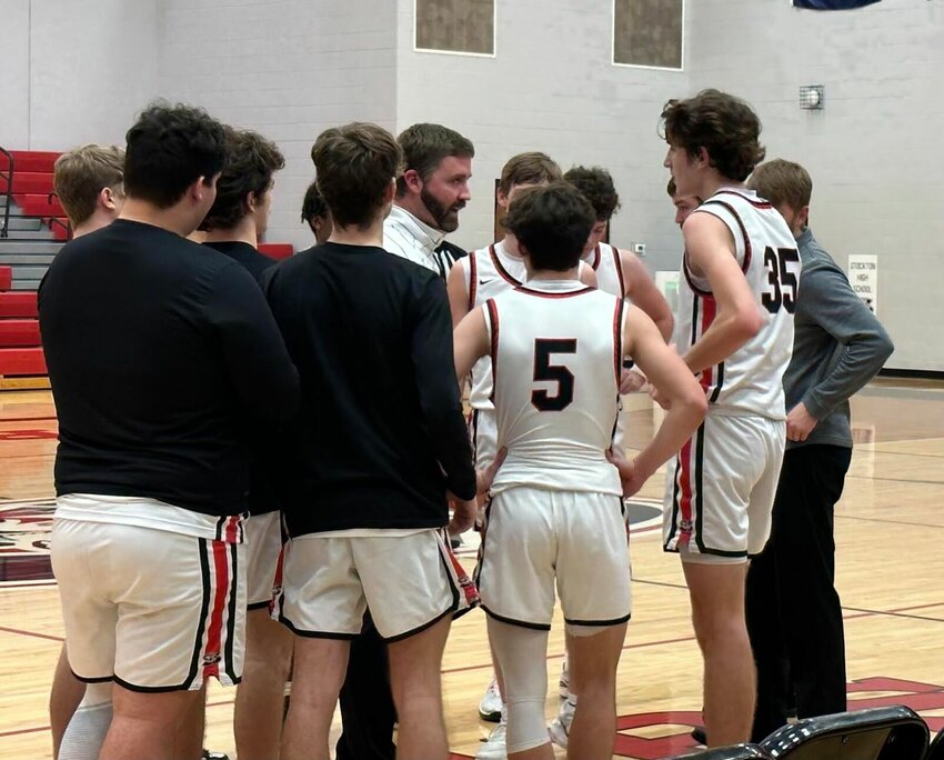 Coach Andrew Boone addresses strategy during a timeout against the visiting Greenwood Bluejays last week. With a tough loss, the Tigers sit at 5-8 as they start play in the 54th Annual Stockton Tournament this week