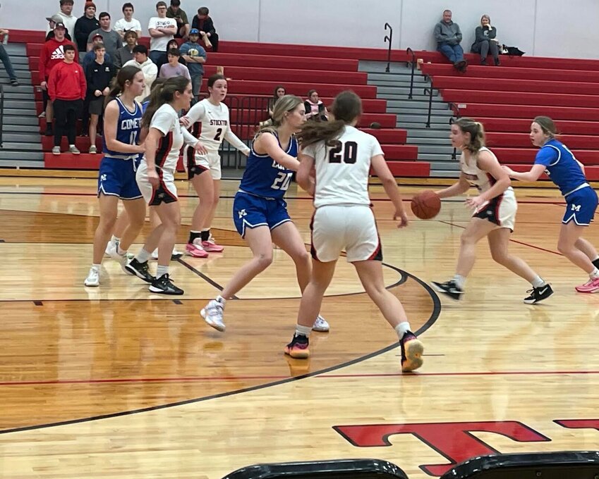 Raelyn Henderson (with ball) looks for an opening last week against Marionville. Ellie Flora (#2), Hayleigh Burres (#20), and Mercedes Rivera are also pictured. The Lady Tigers stunned the visiting Lady Comets, winning 54-43
