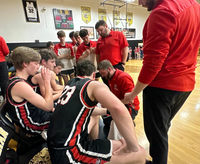 Head Coach Andrew Boone guides his young team during Class 3, District 13 semifinal action last Thursday. The Tigers knocked off the Sherwood Marksmen in quarterfinal action but fell to host Adrian in the semifinal game