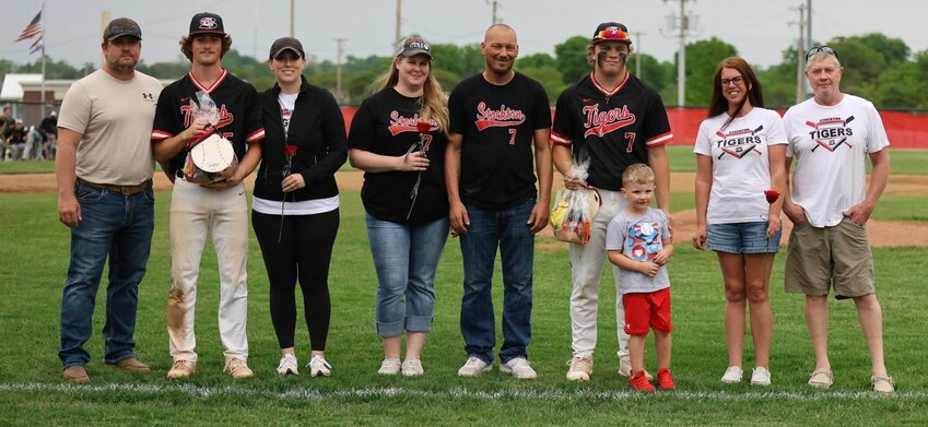 It was senior day last Monday as the Tigers extended their win streak to three games by defeating Pleasant Hope while also securing the Southwest Conference crown. Seniors Sayge Painter (left) and Kolten Goodman were honored for their contributions to Tiger baseball. With Painter are his parents, Wendell and Nicole Painter. With Goodman are Colleen Dawson, Greg Goodman, Kooper, and Stephanie and Eddie Hassell