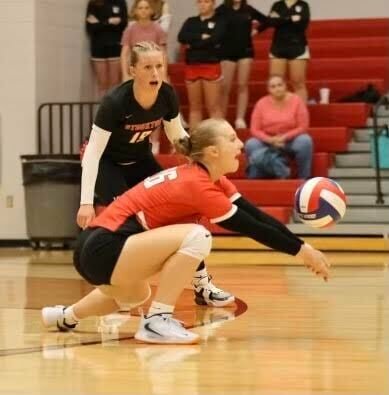 Izabella Graves keeps the ball alive as Sophia Yokley looks on against Fair Grove last week. The Lady Tigers fell, 3-0, to the visiting Eagles.