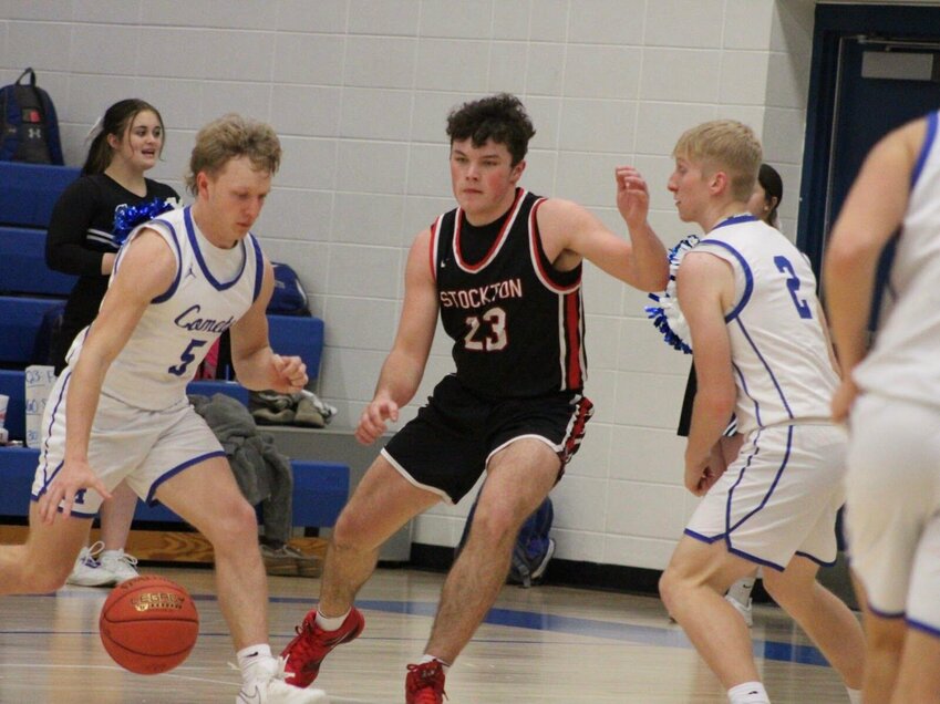 Preston Rains (#23) fights through a pick at Marionville last Tuesday. The Tigers took the victory, 60-41