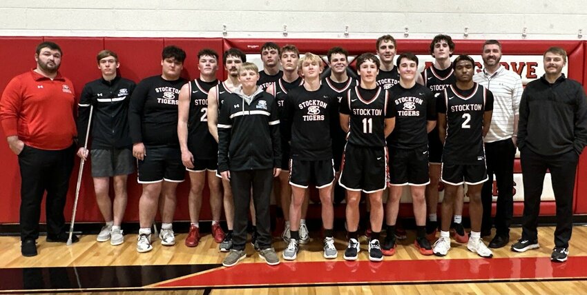 The Stockton Tigers secured at least a share of the Southwest Conference basketball championship last week with a win at Ash Grove. From left: Assistant Coach Gavin Kenney, Colter Woods, Kale Rader, Preston Rains, Logan Reser, Hunter Nolting, Weslee Hargus, Carter Thornton, Wesston Garver, James Flora, Justus King, Ethan Pettit, Cannon Brown, Jax Baxter, Landon Sexton, Head Coach Andrew Boone, and Assistant Coach Ryan Pate.