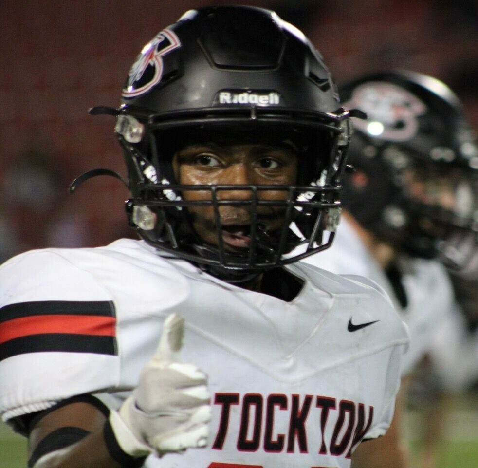 Landon Sexton checks with the official to ensure he is correctly positioned before the Tigers run an offensive play last week at Springfield Central. The Tigers extended their win streak to four with the victory