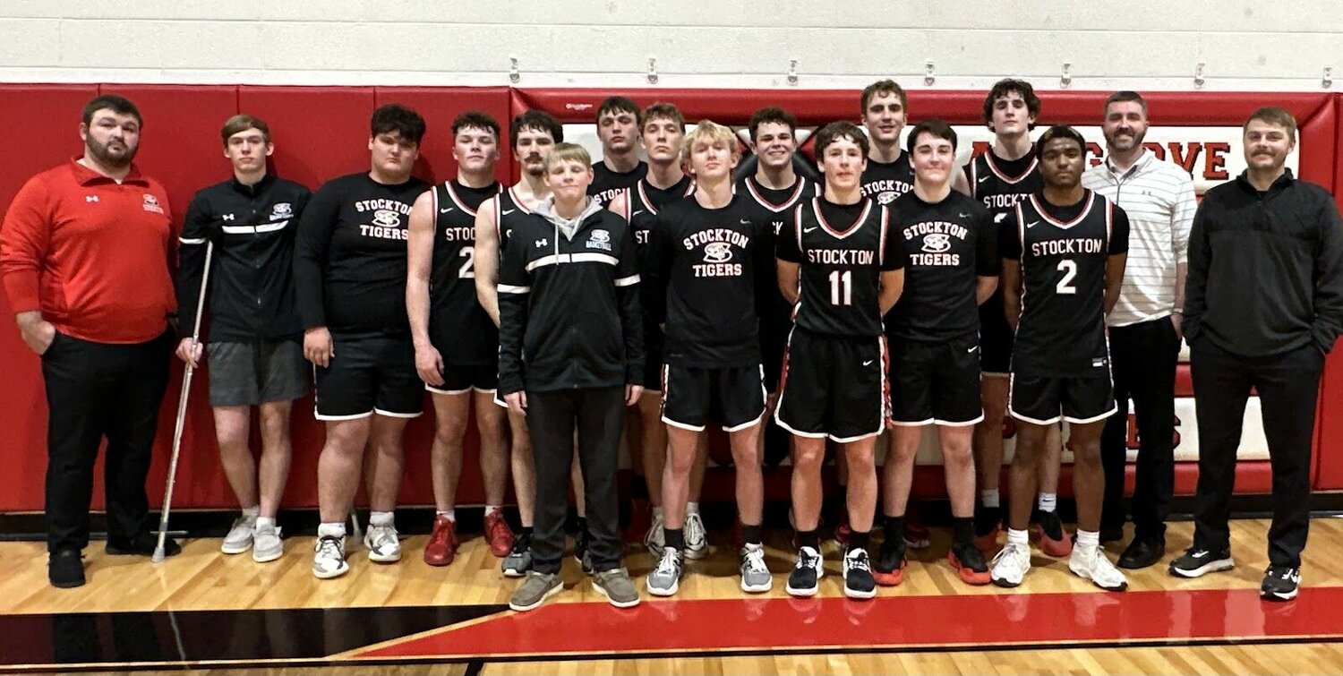 The Stockton Tigers secured at least a share of the Southwest Conference basketball championship last week with a win at Ash Grove. From left: Assistant Coach Gavin Kenney, Colter Woods, Kale Rader, Preston Rains, Logan Reser, Hunter Nolting, Weslee Hargus, Carter Thornton, Wesston Garver, James Flora, Justus King, Ethan Pettit, Cannon Brown, Jax Baxter, Landon Sexton, Head Coach Andrew Boone, and Assistant Coach Ryan Pate.